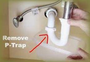removing p-trap connector to unclog drain