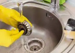 removing food debris from sink