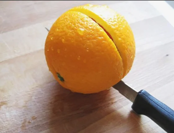 cutting an orange